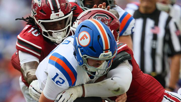Florida quarterback Aaron Philo (12) runs against South Carolina during the first half of an NCAA football at Steve Spurrier Field at Ben Hill Griffin Stadium in Gainesville, FL on Saturday, October 10, 2026. [Alan Youngblood/Gainesville Sun]