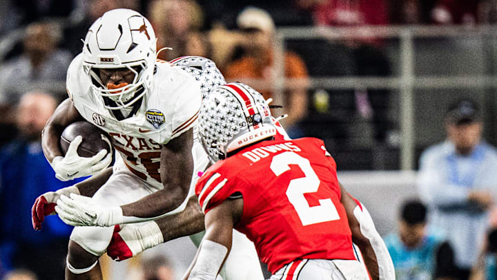 Texas Longhorns running back Quintrevion Wisner (26) runs through Ohio State defense in the second quarter as the Texas Longhorns play the Ohio State Buckeyes in the Cotton Bowl College Football Playoff semi-final at AT&T Stadium in Dallas, Texas, Jan. 10, 2025.