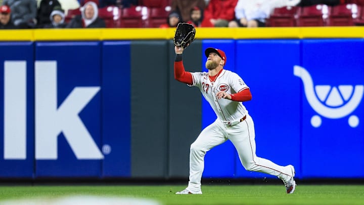 Mar 31, 2025; Cincinnati, Ohio, USA; Cincinnati Reds outfielder Jake Fraley (27) catches a fly out hit by Texas Rangers second baseman Marcus Semien (not pictured) in the eighth inning at Great American Ball Park. Mandatory Credit: Katie Stratman-Imagn Images Mar 31, 2025; Cincinnati, Ohio, USA; Cincinnati Reds outfielder Jake Fraley (27) catches a fly out hit by Texas Rangers second baseman Marcus Semien (not pictured) in the eighth inning at Great American Ball Park. Mandatory Credit: Katie Stratman-Imagn Images