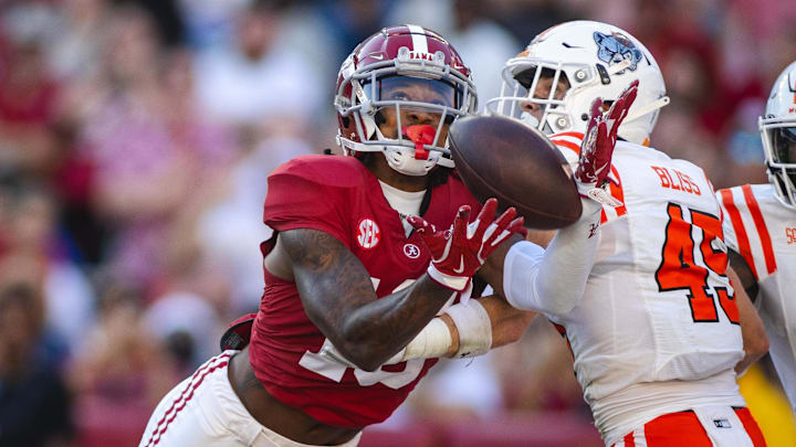 Nov 16, 2024; Tuscaloosa, Alabama, USA; Alabama Crimson Tide wide receiver Jaren Hamilton (16) reaches out for the ball against Mercer Bears safety Tommy Bliss (45) during the fourth quarter at Bryant-Denny Stadium. Mandatory Credit: Will McLelland-Imagn Images