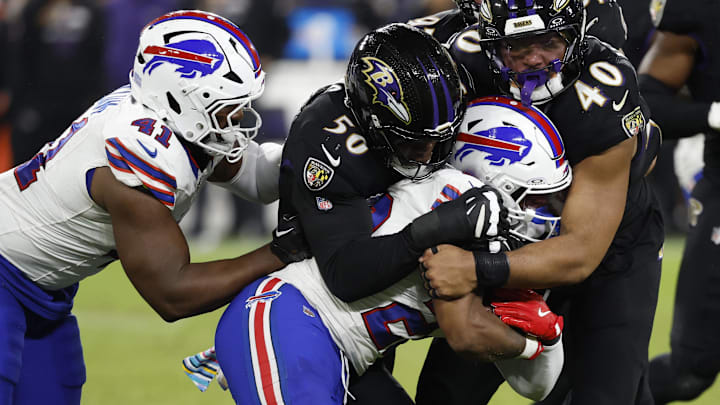 Sep 29, 2024; Baltimore, Maryland, USA; Buffalo Bills running back Ray Davis (22) is tackled by Baltimore Ravens linebacker Adisa Isaac (50) and Ravens linebacker Malik Harrison (40) at M&T Bank Stadium. 