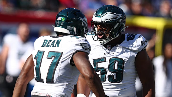 Oct 20, 2024; East Rutherford, New Jersey, USA; Philadelphia Eagles defensive tackle Thomas Booker IV (59) celebrates a sack with linebacker Nakobe Dean (17) during the first half against the New York Giants at MetLife Stadium. Mandatory Credit: Vincent Carchietta-Imagn Images Oct 20, 2024; East Rutherford, New Jersey, USA; Philadelphia Eagles defensive tackle Thomas Booker IV (59) celebrates a sack with linebacker Nakobe Dean (17) during the first half against the New York Giants at MetLife Stadium. Mandatory Credit: Vincent Carchietta-Imagn Images