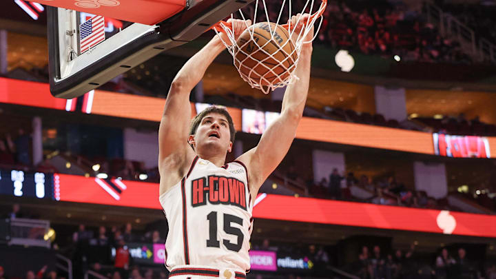 Feb 12, 2025; Houston, Texas, USA; Houston Rockets guard Reed Sheppard (15) dunks against the Phoenix Suns in the second half at Toyota Center. Mandatory Credit: Thomas Shea-Imagn Images
