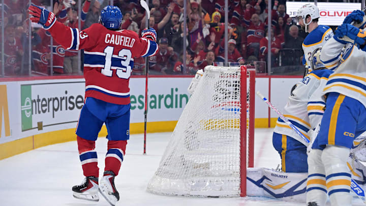 May 12, 2026; Montreal, Quebec, CAN; Montreal Canadiens forward Cole Caufield (13) celebrates after scoring a goal against Buffalo Sabres goalie Ukko-Pekka Luukkonen (1) during the first period in game four of the second round of the 2026 Stanley Cup Playoffs at Bell Centre. Mandatory Credit: Eric Bolte-Imagn Images