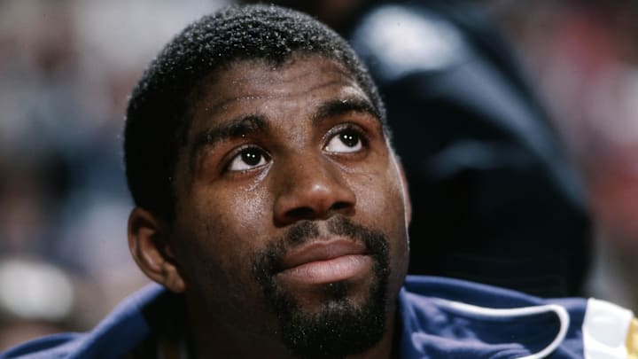 Mar 1, 1988; Seattle, WA , USA: FILE PHOTO; Los Angeles Lakers guard Magic Johnson (32) on the bench against the Seattle Supersonics at Center Coliseum. Mandatory Credit: Imagn Images