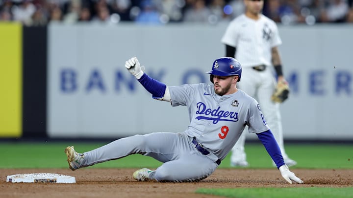 Oct 29, 2024; New York, New York, USA; Los Angeles Dodgers second baseman Gavin Lux (9) slides into second with a double during the second inning in game four of the 2024 MLB World Series against the New York Yankees at Yankee Stadium. Mandatory Credit: Brad Penner-Imagn Images