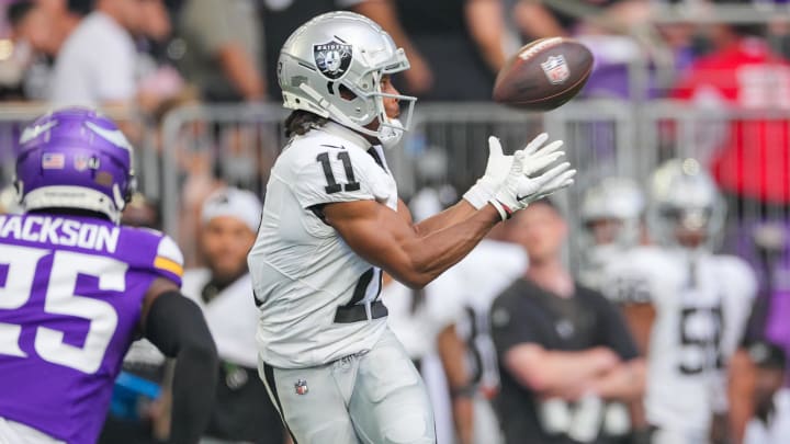 Aug 10, 2024; Minneapolis, Minnesota, USA; Las Vegas Raiders wide receiver Tre Tucker (11) catches a pass against the Minnesota Vikings in the second quarter at U.S. Bank Stadium. Mandatory Credit: Brad Rempel-USA TODAY Sports