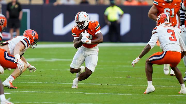 Nov 8, 2025; Miami Gardens, Florida, USA; Miami Hurricanes running back Jordan Lyle (2) rushes the ball against the Syracuse Orange during the first quarter at Hard Rock Stadium. Mandatory Credit: Jeff Romance-Imagn Images