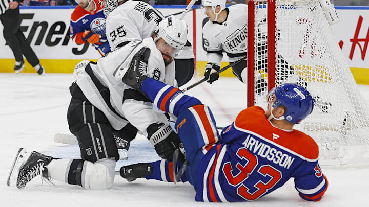 Apr 25, 2025; Edmonton, Alberta, CAN; Los Angeles Kings defensemen Drew Doughty (8) and Edmonton Oilers forward Victor Arvidsson (33) battle for position during the first period in game three of the first round of the 2025 Stanley Cup Playoffs at Rogers Place. Mandatory Credit: Perry Nelson-Imagn Images