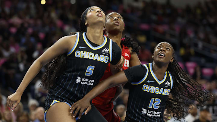 Aug 30, 2024; Chicago, Illinois, USA; Chicago Sky forward Angel Reese (5) and forward Michaela Onyenwere (12) defend against Indiana Fever forward Aliyah Boston (7) during the first half at Wintrust Arena. Mandatory Credit: Kamil Krzaczynski-Imagn Images Aug 30, 2024; Chicago, Illinois, USA; Chicago Sky forward Angel Reese (5) and forward Michaela Onyenwere (12) defend against Indiana Fever forward Aliyah Boston (7) during the first half at Wintrust Arena. Mandatory Credit: Kamil Krzaczynski-Imagn Images