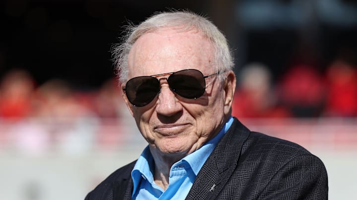 Nov 16, 2024; Fayetteville, Arkansas, USA; Dallas Cowboys owner and member of the 1964 Arkansas Razorbacks National Championship team, Jerry Jones, looks on as the team is honored during the first half against the Texas Longhorns at Donald W. Reynolds Razorback Stadium. Mandatory Credit: Nelson Chenault-Imagn Images
