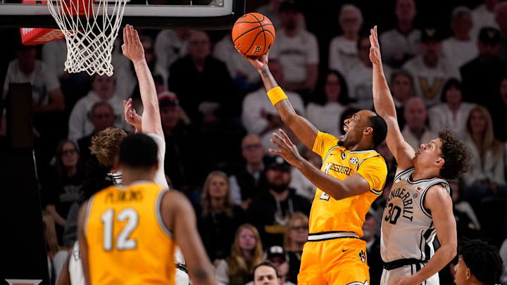 Missouri guard Tamar Bates (2) shoots past Vanderbilt guard Chris Manon (30) during the first half at Memorial Gym in Nashville, Tenn., Saturday, March 1, 2025. Missouri guard Tamar Bates (2) shoots past Vanderbilt guard Chris Manon (30) during the first half at Memorial Gym in Nashville, Tenn., Saturday, March 1, 2025.