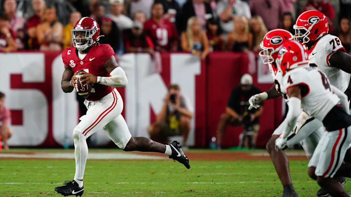 Sep 28, 2024; Tuscaloosa, Alabama, USA; Alabama Crimson Tide quarterback Jalen Milroe (4) rolls out to throw against the Georgia Bulldogs during the fourth quarter at Bryant-Denny Stadium. Mandatory Credit: John David Mercer-Imagn Images Sep 28, 2024; Tuscaloosa, Alabama, USA; Alabama Crimson Tide quarterback Jalen Milroe (4) rolls out to throw against the Georgia Bulldogs during the fourth quarter at Bryant-Denny Stadium. Mandatory Credit: John David Mercer-Imagn Images