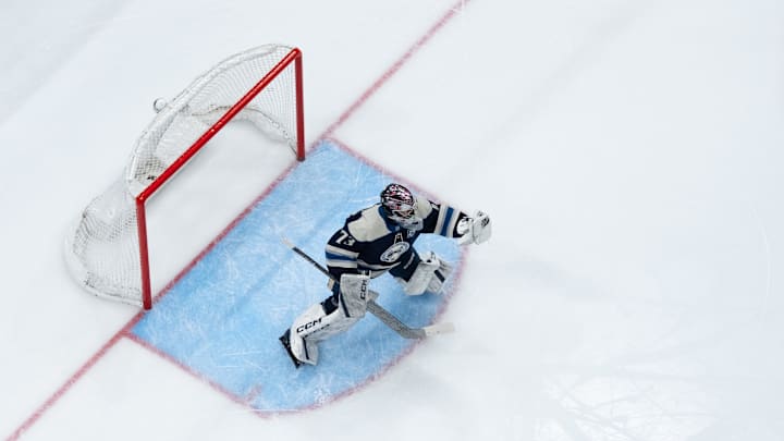 Feb 28, 2026; Columbus, Ohio, USA;  Columbus Blue Jackets goaltender Jet Greaves (73) makes a save in net against the New York Islanders in the first period at Nationwide Arena. Mandatory Credit: Aaron Doster-Imagn Images