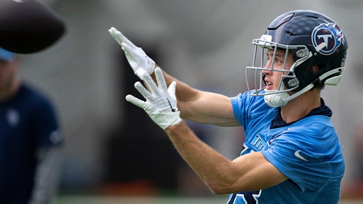 Wide receiver Kyle Phillips (18) hauls in a pass during the Tennessee Titans mandatory mini-camp at Ascension Saint Thomas Sports Park in Nashville, Tenn., Tuesday, June 4, 2024.