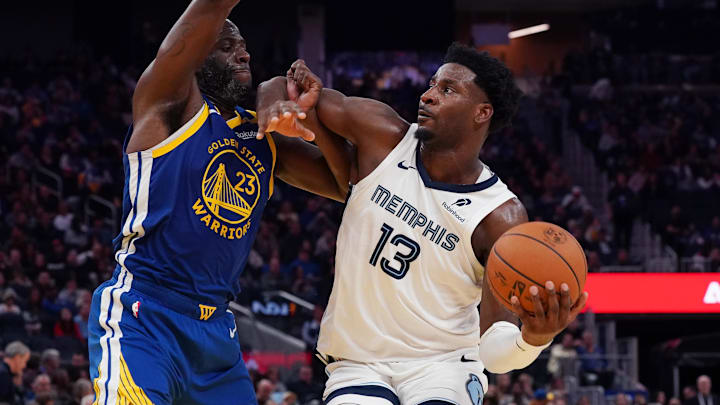 Jan 4, 2025; San Francisco, California, USA;  Memphis Grizzlies forward/center Jaren Jackson Jr. (13) drives to the basket against Golden State Warriors forward Draymond Green (23) in the third quarter at Chase Center. Mandatory Credit: David Gonzales-Imagn Images