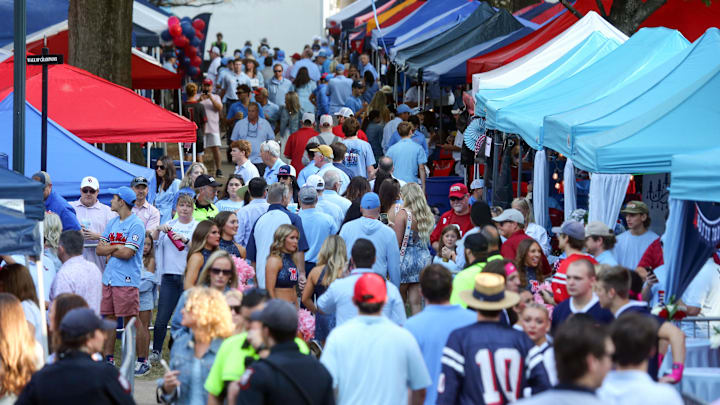 Oct 26, 2024; Oxford, Mississippi, USA; Mississippi Rebels fans walk around the Grove prior to the game against the Oklahoma Sooners at Vaught-Hemingway Stadium. Mandatory Credit: Petre Thomas-Imagn Images Oct 26, 2024; Oxford, Mississippi, USA; Mississippi Rebels fans walk around the Grove prior to the game against the Oklahoma Sooners at Vaught-Hemingway Stadium. Mandatory Credit: Petre Thomas-Imagn Images