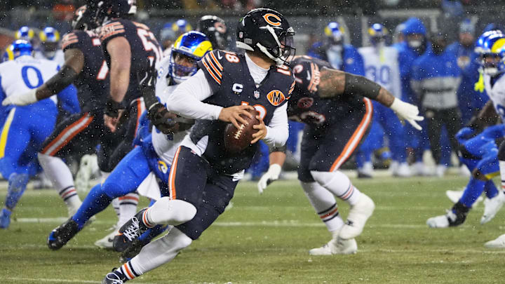 Jan 18, 2026; Chicago, IL, USA; Chicago Bears quarterback Caleb Williams (18) scrambles against the Los Angeles Rams during the first quarter of an NFC Divisional Round game at Soldier Field. Mandatory Credit: David Banks-Imagn Images