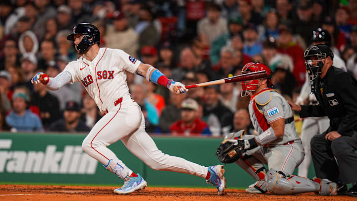 May 12, 2026; Boston, Massachusetts, USA; Boston Red Sox shortstop Trevor Story (10) hits a single against the Philadelphia Phillies in the seventh inning at Fenway Park. Mandatory Credit: David Butler II-Imagn Images