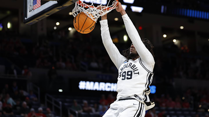 Mar 19, 2026; Oklahoma City, OK, USA; Vanderbilt Commodores forward Devin McGlockton (99) dunks during the first half against the McNeese Cowboys during a first round game of the men's 2026 NCAA Tournament at Paycom Center. Mandatory Credit: Alonzo Adams-Imagn Images