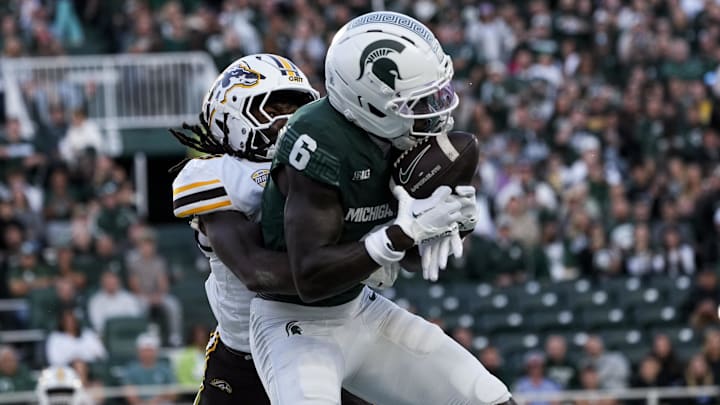 Aug 29, 2025; East Lansing, Michigan, USA; Michigan State Spartans wide receiver Nick Marsh (6) catches a touchdown pass in the second quarter at Spartan Stadium. Mandatory Credit: Brendan Mullin-Imagn Images