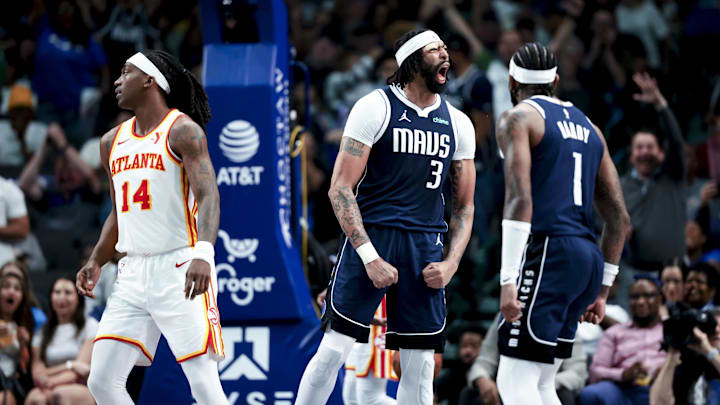 Dallas Mavericks forward Davis reacts in front of Atlanta Hawks guard Mann during the fourth quarter at American Airlines Center. 