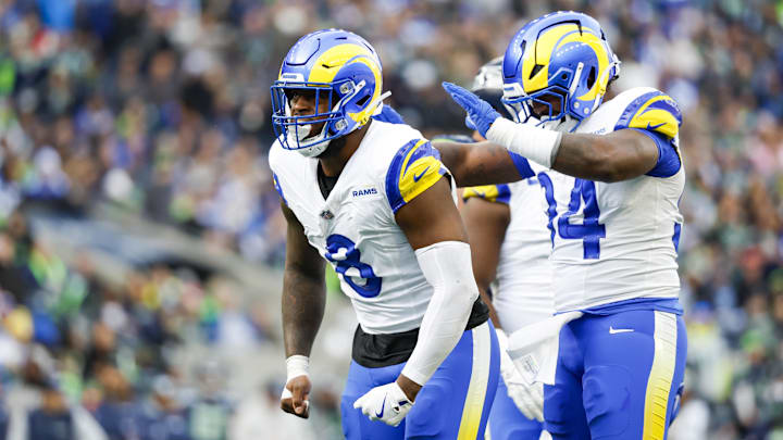 Nov 3, 2024; Seattle, Washington, USA; Los Angeles Rams linebacker Jared Verse (8) celebrates with cornerback Cobie Durant (14) after a sack against the Seattle Seahawks during the second quarter at Lumen Field. Mandatory Credit: Joe Nicholson-Imagn Images