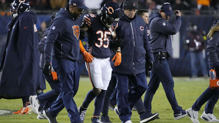 Jan 4, 2026; Chicago, Illinois, USA; Chicago Bears safety C.J. Gardner-Johnson (35) is helped off the field after a play against the Detroit Lions during the second half at Soldier Field. Mandatory Credit: David Banks-Imagn Images