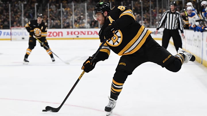 Apr 23, 2026; Boston, Massachusetts, USA; Boston Bruins right wing David Pastrnak (88) takes a shot against the Buffalo Sabres during the third period of game three of the first round of the 2026 Stanley Cup Playoffs at the TD Garden. Mandatory Credit: Brian Fluharty-Imagn Images