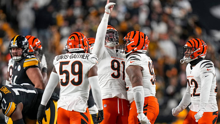 Cincinnati Bengals defensive end Trey Hendrickson (91) celebrates after sacking Pittsburgh Steelers quarterback Russell Wilson (3) in the first quarter of the NFL Week 18 game between the Pittsburgh Steelers and the Cincinnati Bengals at Acrisure Stadium in Pittsburgh on Saturday, Jan. 4, 2025.