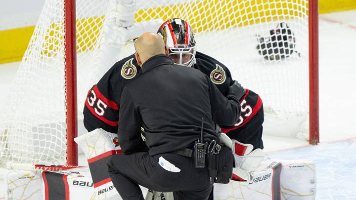 Oct 21, 2026; Ottawa, Ontario, CAN;  Ottawa Senators Athletic Therapist Domenic Nicoletta checks on goalie Linus Ullmark (35) after he sustained an injury in the third period at the Canadian Tire Centre.  Mandatory Credit: Marc DesRosiers-Imagn