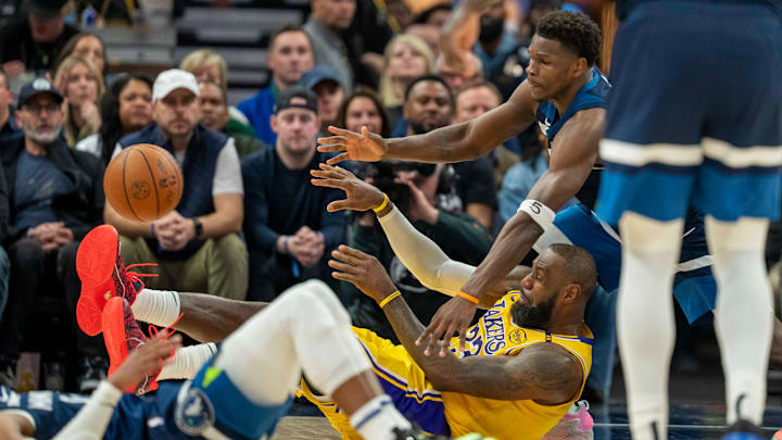Los Angeles Lakers forward LeBron James passes the ball from the ground as Minnesota Timberwolves guard Anthony Edwards defends in the first half during Game 3 of their first-round playoff series at Target Center in Minneapolis on April 25, 2025. Los Angeles Lakers forward LeBron James passes the ball from the ground as Minnesota Timberwolves guard Anthony Edwards defends in the first half during Game 3 of their first-round playoff series at Target Center in Minneapolis on April 25, 2025.
