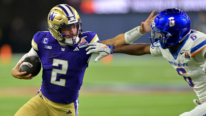 Dec 13, 2025; Inglewood, CA, USA;  Washington Huskies quarterback Demond Williams Jr. (2) is forced out of bounds by Boise State Broncos defensive back Jeremiah Earby (6) after a catching a pass in the second half of the LA Bowl at SoFi Stadium. Mandatory Credit: Jayne Kamin-Oncea-Imagn Images