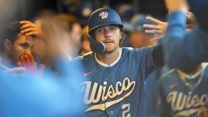 Apr 12, 2026; Milwaukee, Wisconsin, USA;  Milwaukee Brewers second baseman Brice Turang (2) celebrates in the dugout after hitting a home run during the third inning against the Washington Nationals at American Family Field. Mandatory Credit: Jeff Hanisch-Imagn Images