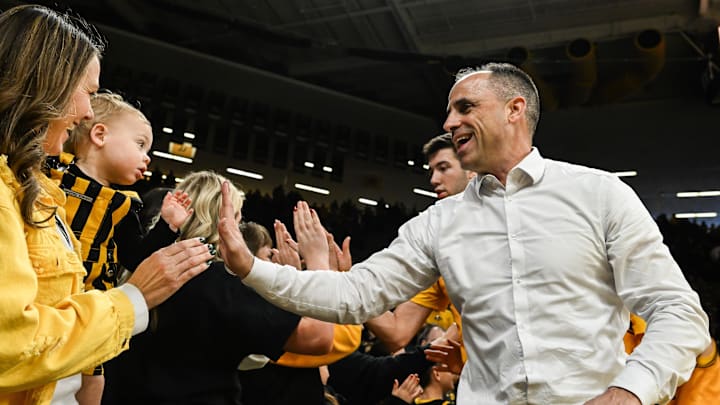Feb 8, 2026; Iowa City, Iowa, USA; Iowa Hawkeyes head coach Ben McCollum reacts with fans after the game against the Northwestern Wildcats at Carver-Hawkeye Arena. Mandatory Credit: Jeffrey Becker-Imagn Images Feb 8, 2026; Iowa City, Iowa, USA; Iowa Hawkeyes head coach Ben McCollum reacts with fans after the game against the Northwestern Wildcats at Carver-Hawkeye Arena. Mandatory Credit: Jeffrey Becker-Imagn Images
