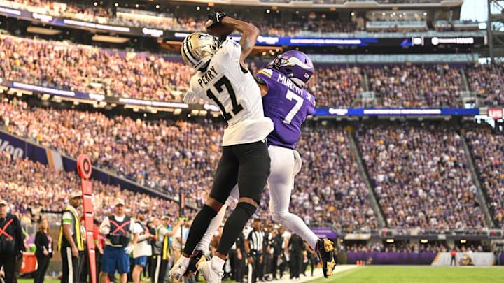 New Orleans Saints receiver A.T. Perry (17) catches a touchdown pass over Vikings cornerback Byron Murphy Jr. (7)