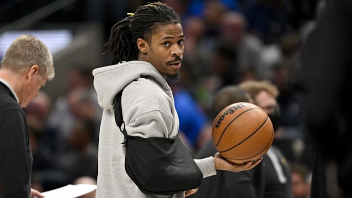 Jan 9, 2024; Dallas, Texas, USA; Memphis Grizzlies guard Ja Morant (12) looks on while wearing his