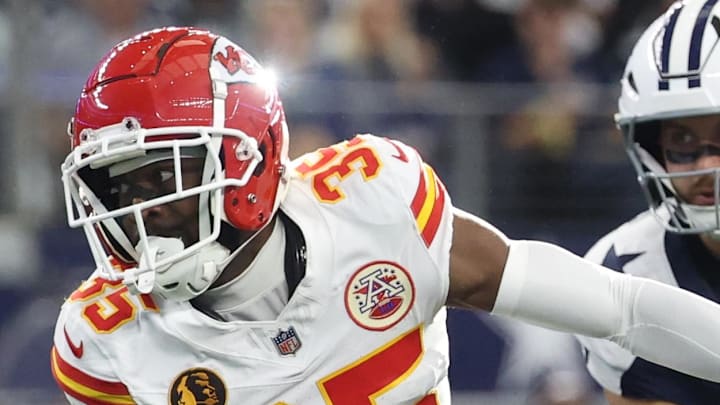 Nov 27, 2025; Arlington, Texas, USA; Kansas City Chiefs cornerback Jaylen Watson (35) returns an interception against Dallas Cowboys tight end Jake Ferguson (87) at AT&T Stadium. Mandatory Credit: Kevin Jairaj-Imagn Images
