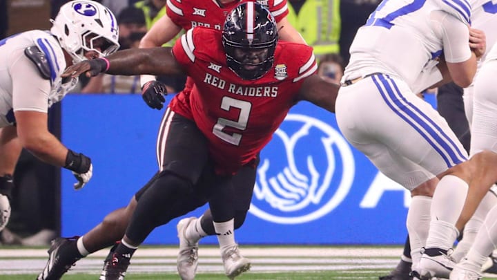 Texas Tech's Lee Hunter tries to cave in the line against BYU. Texas Tech's Lee Hunter tries to cave in the line against BYU.