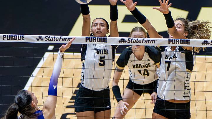 Purdue's Taylor Anderson and Bianka Lulic attempt a block. Purdue's Taylor Anderson and Bianka Lulic attempt a block.