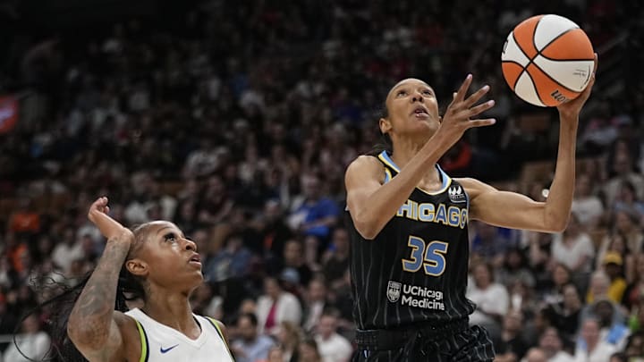 May 13, 2023; Toronto, Ontario, Canada; Chicago Sky guard Rebekah Gardner (35) goes up to make a basket against Minnesota Lynx guard Tiffany Mitchell (25) during the first half at Scotiabank Arena. Mandatory Credit: John E. Sokolowski-Imagn Images