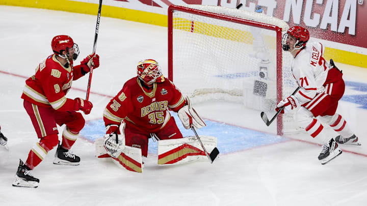 Apr 11, 2024; Saint Paul, Minnesota, USA; Boston University Terriers forward Macklin Celebrini (71) shoots against Denver Pioneers goaltender Matt Davis (35) during the second period in the semifinals of the 2024 Frozen Four college ice hockey tournament at Xcel Energy Center. Mandatory Credit: Matt Krohn-Imagn Images