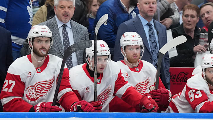 Apr 17, 2025; Toronto, Ontario, CAN; Detroit Red Wings head coach Todd McLellan watches the play against the Toronto Maple Leafs during the third period at Scotiabank Arena. Mandatory Credit: Nick Turchiaro-Imagn Images