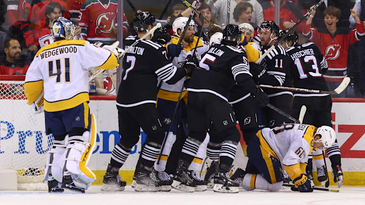 Nov 25, 2024; Newark, New Jersey, USA; The New Jersey Devils and the Nashville Predators fight after a hit by New Jersey Devils right wing Timo Meier (28) (not shown) during the third period at Prudential Center. Mandatory Credit: Ed Mulholland-Imagn Images
