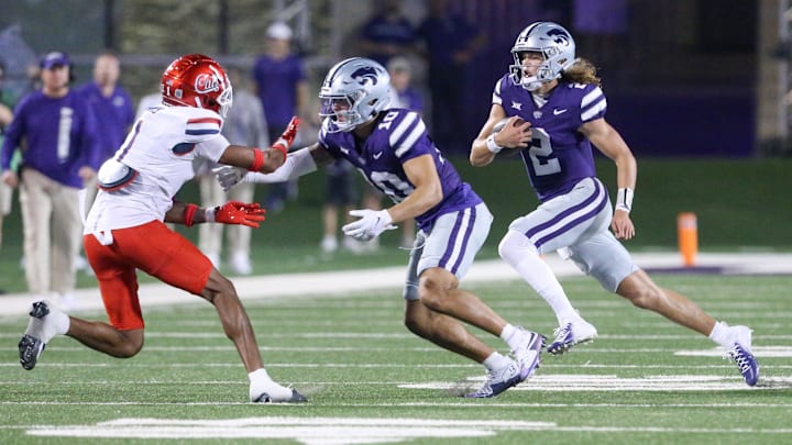 Sep 13, 2024; Manhattan, Kansas, USA; Kansas State Wildcats quarterback Avery Johnson (2) follows the block by wide receiver Keagan Johnson (10) on Arizona Wildcats defensive back Tacario Davis (1) during the third quarter at Bill Snyder Family Football Stadium. Mandatory Credit: Scott Sewell-Imagn Images
