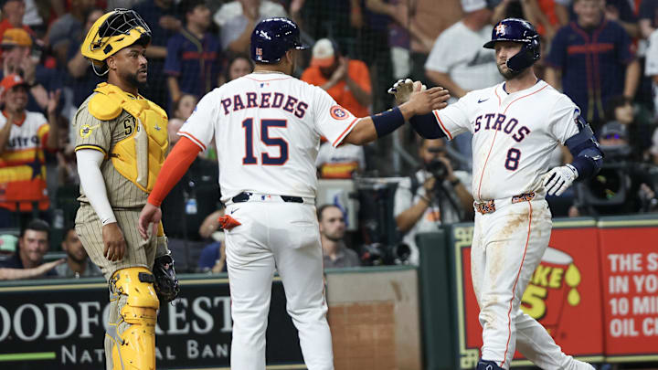 Apr 19, 2025; Houston, Texas, USA; Houston Astros third baseman Isaac Paredes (15) celebrates first baseman Christian Walker (8)  two run home run against the San Diego Padres  in the sixth inning at Daikin Park.