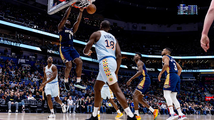 Feb 23, 2025; New Orleans, Louisiana, USA;  New Orleans Pelicans forward Zion Williamson (1) dunks the ball against San Antonio Spurs center Bismack Biyombo (18) during the first half at Smoothie King Center. Mandatory Credit: Stephen Lew-Imagn Images