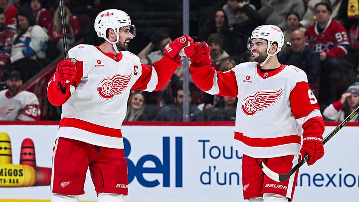 Detroit Red Wings center Dylan Larkin (71) celebrates with right wing Alex DeBrincat (93): David Kirouac-Imagn Images