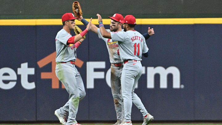 Sep 3, 2024; Milwaukee, Wisconsin, USA; St. Louis Cardinals outfielder Lars Nootbaar (21), St. Louis Cardinals outfielder Michael Siani (63) and St. Louis Cardinals outfielder Victor Scott II (11) celebrate a 5-4 win over the Milwaukee Brewers in 12 innings at American Family Field. Mandatory Credit: Michael McLoone-Imagn Images Sep 3, 2024; Milwaukee, Wisconsin, USA; St. Louis Cardinals outfielder Lars Nootbaar (21), St. Louis Cardinals outfielder Michael Siani (63) and St. Louis Cardinals outfielder Victor Scott II (11) celebrate a 5-4 win over the Milwaukee Brewers in 12 innings at American Family Field. Mandatory Credit: Michael McLoone-Imagn Images