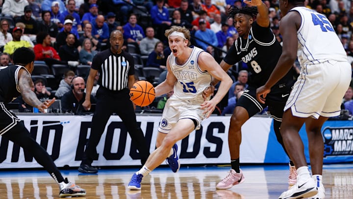 Mar 20, 2025; Denver, CO, USA; Brigham Young Cougars forward Richie Saunders (15) drives to the basket against VCU Rams guard Michael Belle (8) during the second half in the first round of the NCAA Tournament at Ball Arena. Mandatory Credit: Isaiah J. Downing-Imagn Images Mar 20, 2025; Denver, CO, USA; Brigham Young Cougars forward Richie Saunders (15) drives to the basket against VCU Rams guard Michael Belle (8) during the second half in the first round of the NCAA Tournament at Ball Arena. Mandatory Credit: Isaiah J. Downing-Imagn Images